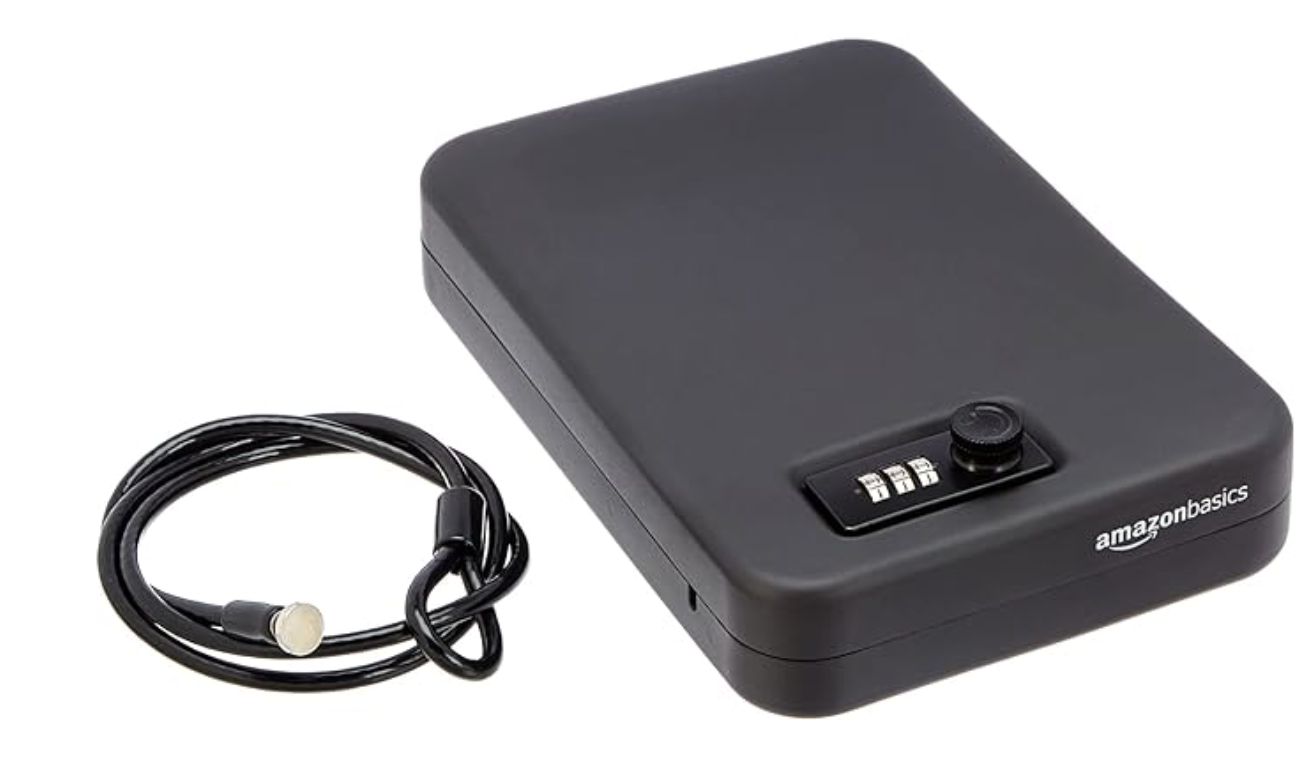 Image of the Amazon Basics Portable Security Case Lock Box Safe, an extra-large black lockbox with a combination lock. The case features a sturdy metal construction with a sleek black finish, designed for securing valuables like cash, documents, and small electronics. The combination lock is located on the front, offering keyless entry for added security. The lockbox is shown with the lid closed, highlighting its compact and portable design, making it ideal for use at home, in the office, or on the go.